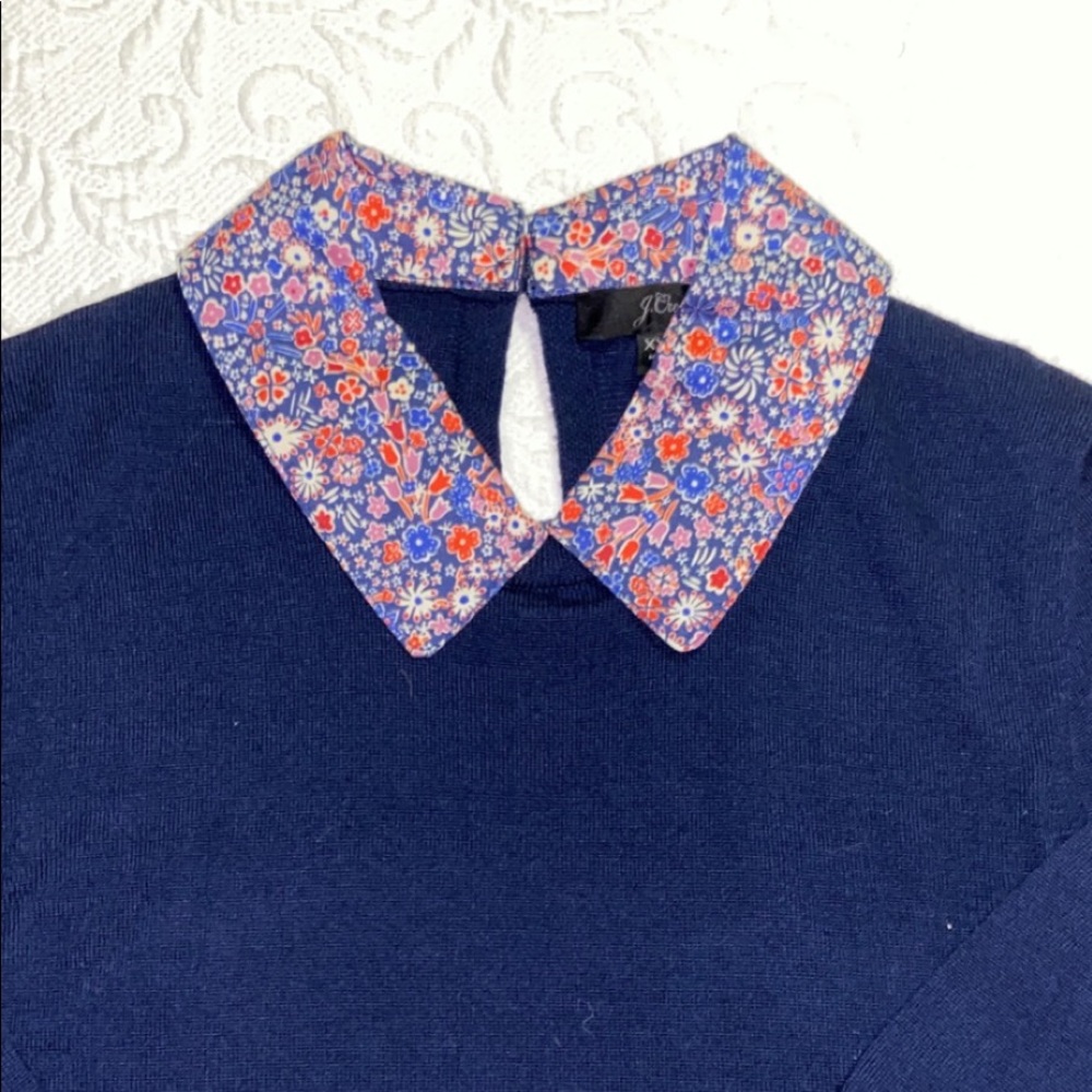 Navy sweater with floral collar